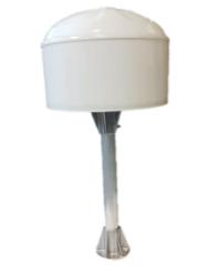 A stool next to a lamp  Description generated with high confidence